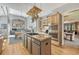 Open kitchen with a center island, stainless steel appliances, and access to the Gathering room at 1410 Old Sequoia Ct, Franktown, CO 80116