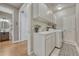 Well-lit laundry room with ample cabinet space and modern appliances at 1410 Old Sequoia Ct, Franktown, CO 80116