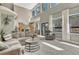 Bright living room boasting vaulted ceilings, many windows, and a neutral color palette at 1410 Old Sequoia Ct, Franktown, CO 80116