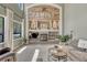 Cozy living room featuring a unique wood accent wall, fireplace, and ample seating at 1410 Old Sequoia Ct, Franktown, CO 80116
