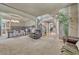 Cozy living area with hardwood floors, dining area, and staircase access at 1410 Old Sequoia Ct, Franktown, CO 80116