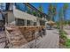 Exterior bar area with seating, perfect for entertaining, with a view of the outdoor living space at 1410 Old Sequoia Ct, Franktown, CO 80116