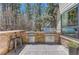 Outdoor kitchen with a built-in grill, prep space, and bar seating at 1410 Old Sequoia Ct, Franktown, CO 80116