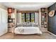 The sitting area features many framed pictures, a black framed window, and a bench with pillows at 1410 Old Sequoia Ct, Franktown, CO 80116