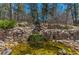Scenic stone waterfall and pond, enhancing the property's natural beauty at 1410 Old Sequoia Ct, Franktown, CO 80116