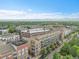 Beautiful aerial showing the residential buildings, trees, and distant mountain views at 7240 W Custer Ave # 301, Lakewood, CO 80226