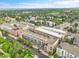 Extensive aerial view of the community, featuring buildings, trees, and roads at 7240 W Custer Ave # 301, Lakewood, CO 80226