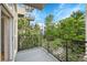 Balcony with metal railings and views of trees and other nearby apartment buildings at 7240 W Custer Ave # 301, Lakewood, CO 80226