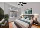 Bedroom with large window, ceiling fan and hardwood floors at 7240 W Custer Ave # 301, Lakewood, CO 80226