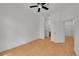 Bright bedroom with hardwood floors and ceiling fan, adjacent to walk-in closet and bathroom at 7240 W Custer Ave # 301, Lakewood, CO 80226
