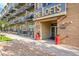 Condominium building entrance featuring brick facade and modern signage at 7240 W Custer Ave # 301, Lakewood, CO 80226