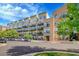 Exterior view of the Lofts building with balconies and parking at 7240 W Custer Ave # 301, Lakewood, CO 80226