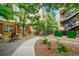 Courtyard with table and chairs, landscaping, and a walkway at 7240 W Custer Ave # 301, Lakewood, CO 80226