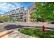 Street view of The Lofts building with attractive architecture and well-maintained landscaping at 7240 W Custer Ave # 301, Lakewood, CO 80226