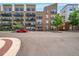 Exterior view of modern condo building with reserved parking at 7240 W Custer Ave # 301, Lakewood, CO 80226