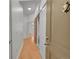 Hallway with laundry closet behind sliding door at 7240 W Custer Ave # 301, Lakewood, CO 80226