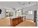 Modern kitchen with a large island, stainless steel appliances, and hardwood floors at 7240 W Custer Ave # 301, Lakewood, CO 80226