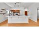 Kitchen featuring quartz counters and stainless appliances, with hardwood floors at 7240 W Custer Ave # 301, Lakewood, CO 80226