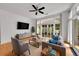Bright living room with large windows, modern furnishings, and hardwood floors at 7240 W Custer Ave # 301, Lakewood, CO 80226