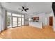Open concept living space featuring kitchen and living room with bright light and balcony access at 7240 W Custer Ave # 301, Lakewood, CO 80226
