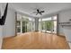 Open living room with large windows providing beautiful natural light and hardwood floors at 7240 W Custer Ave # 301, Lakewood, CO 80226