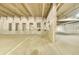 Interior view of a concrete parking garage with marked parking spots at 7240 W Custer Ave # 301, Lakewood, CO 80226