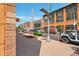 View of the street showing storefronts, the Century sign, and vehicles at 7240 W Custer Ave # 301, Lakewood, CO 80226