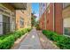 Walkway between buildings with lush green landscaping at 7240 W Custer Ave # 301, Lakewood, CO 80226