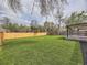 Sprawling backyard with lush green grass and a newly stained fence perfect for outdoor enjoyment at 920 S Hudson St, Denver, CO 80246