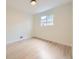 Empty bedroom with hardwood floors and a bright window at 920 S Hudson St, Denver, CO 80246