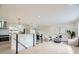 Open-concept living space with lots of natural light, hardwood floors, modern railings and neutral decor at 920 S Hudson St, Denver, CO 80246