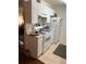 Well-equipped kitchen with white cabinets and modern appliances at 10762 E Exposition Ave # 336, Aurora, CO 80112