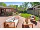 This backyard patio features elegant outdoor seating and a well-manicured lawn, great for entertaining guests at 720 S Clayton St, Denver, CO 80209
