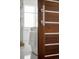 Modern bathroom door with sleek handle and a glimpse of a soaking tub at 720 S Clayton St, Denver, CO 80209