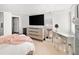 Bright and airy bedroom features a vanity, large TV, and ample closet space at 720 S Clayton St, Denver, CO 80209