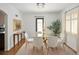Bright dining room with a glass table, chandelier, and modern decor at 720 S Clayton St, Denver, CO 80209