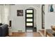 Inviting foyer with hardwood floors, contemporary lighting, and an arched doorway at 720 S Clayton St, Denver, CO 80209
