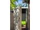 Weathered gate opening onto green grass at 720 S Clayton St, Denver, CO 80209