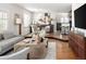 Spacious living area with modern furnishings, an open layout, and a stylish transition to the kitchen at 720 S Clayton St, Denver, CO 80209