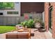 Cozy patio featuring comfortable seating arrangements and stylish decor with a hanging chair at 720 S Clayton St, Denver, CO 80209