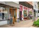 Charming storefront with a wooden door and an A-frame sign, located on the Silk Road at 720 S Clayton St, Denver, CO 80209