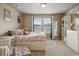 Cozy bedroom with plush carpet, a comfortable bed, and ample natural light at 15275 W La Salle Ave, Lakewood, CO 80228