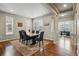 Elegant dining room with modern furnishings, rich hardwood floors, and abundant natural light at 15275 W La Salle Ave, Lakewood, CO 80228