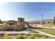 Stone monument marks the entrance to the community, with manicured landscaping and mountain views at 15275 W La Salle Ave, Lakewood, CO 80228