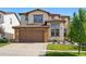 Charming two-story home with a two-car garage and a beautifully landscaped front yard at 15275 W La Salle Ave, Lakewood, CO 80228