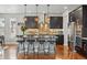 Modern kitchen with stainless steel appliances, granite countertops, and bar stool seating at 15275 W La Salle Ave, Lakewood, CO 80228