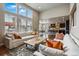 Spacious open-concept living room with hardwood floors, high ceilings, and plenty of natural light at 15275 W La Salle Ave, Lakewood, CO 80228