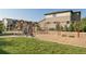 Community playground area with swings, climbing structure, and a slide at 15275 W La Salle Ave, Lakewood, CO 80228