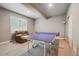 Recreation room with a table tennis setup and comfortable seating area, perfect for Gathering activities at 15275 W La Salle Ave, Lakewood, CO 80228