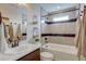 Modern bathroom with a shower-tub, and a bright window for natural light at 1163 Highview Dr, Erie, CO 80516